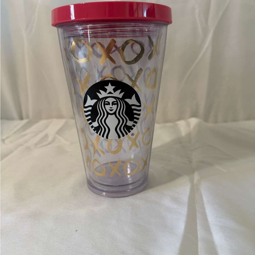 Starbucks Clear Tumbler with Pink Lid and Gold XO Pattern. No straw.